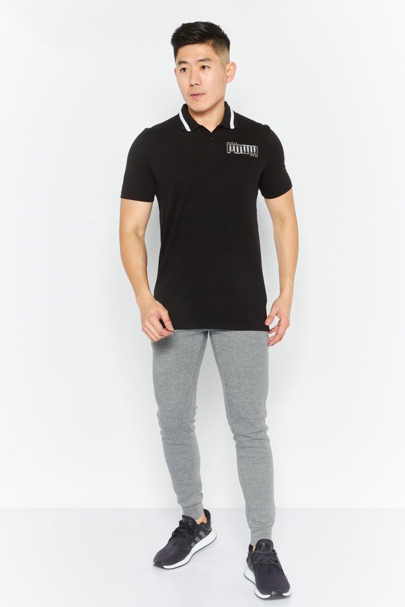 PUMA تي شيرت بولو قصير الأكمام للرجال بتصميم رياضي مع شعار العلامة التجارية، أسود - Image 4